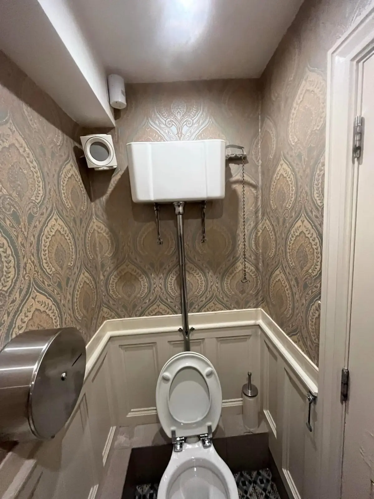Damask wallpaper hung in a downstairs WC